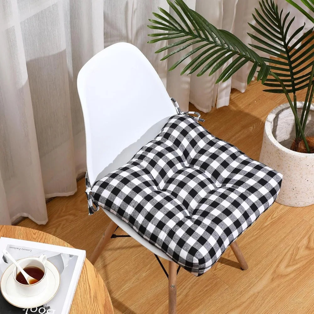 Set of four outdoor chair cushions from Your Outdoors n' More with colorful fabric covers and plush padding for comfort.