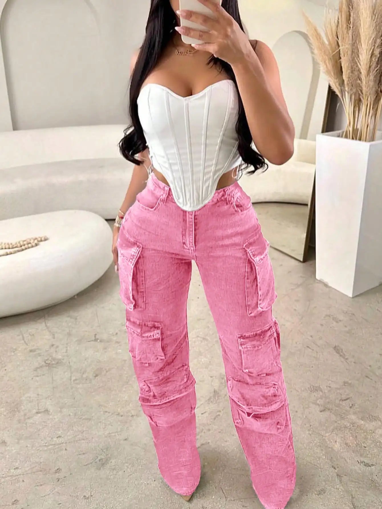 Women's pink cargo jeans from Your Outdoors n' More featuring multiple pockets and a relaxed fit.