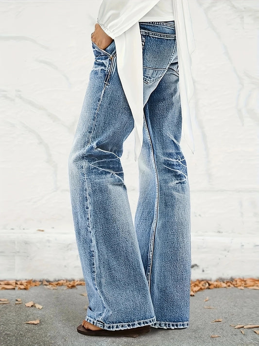 Women's high waisted washed, loose and slightly flared jeans.