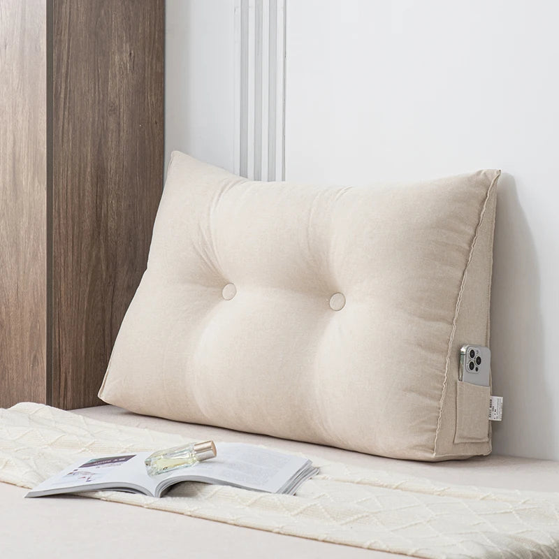 Small triangular wedge pillow with built-in massager from Your Outdoors n' More, designed for comfortable support and relaxation.