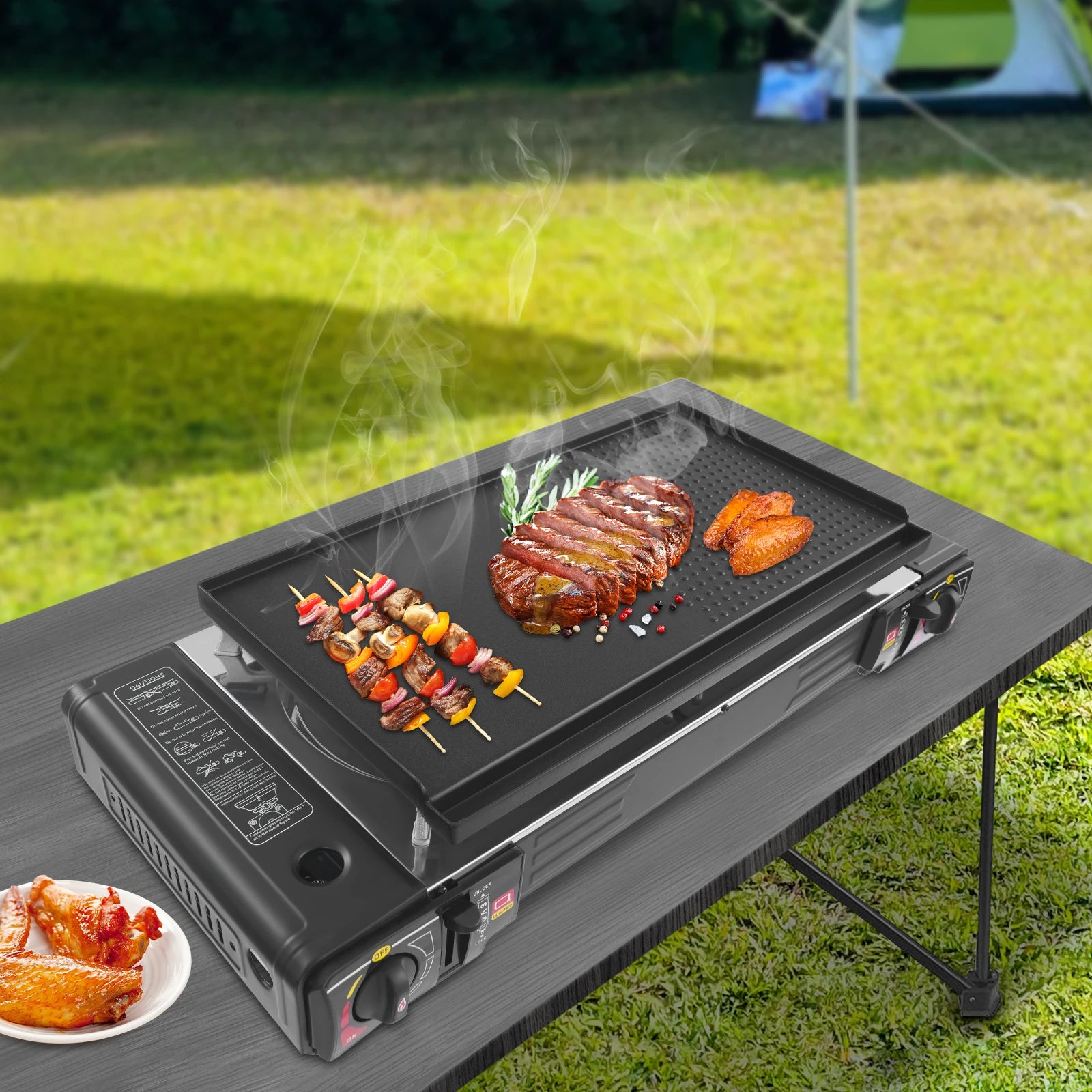Two-burner family camping gas stove with grill pan from Your Outdoors n' More, featuring cooking surface and control knobs.