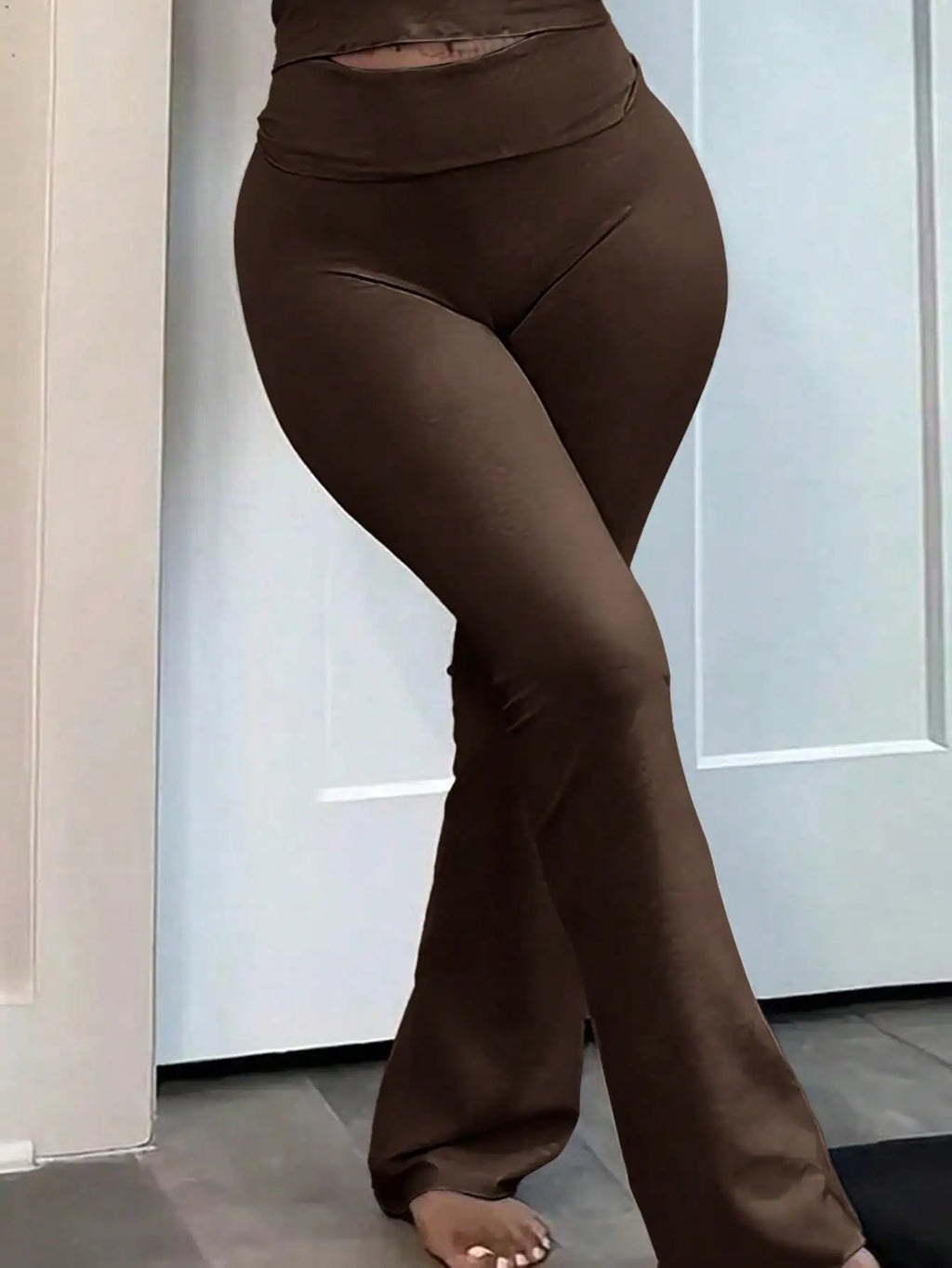 Set of three women's high-waisted flared pants from Your Outdoors n' More, showcasing different colors and relaxed fit design.