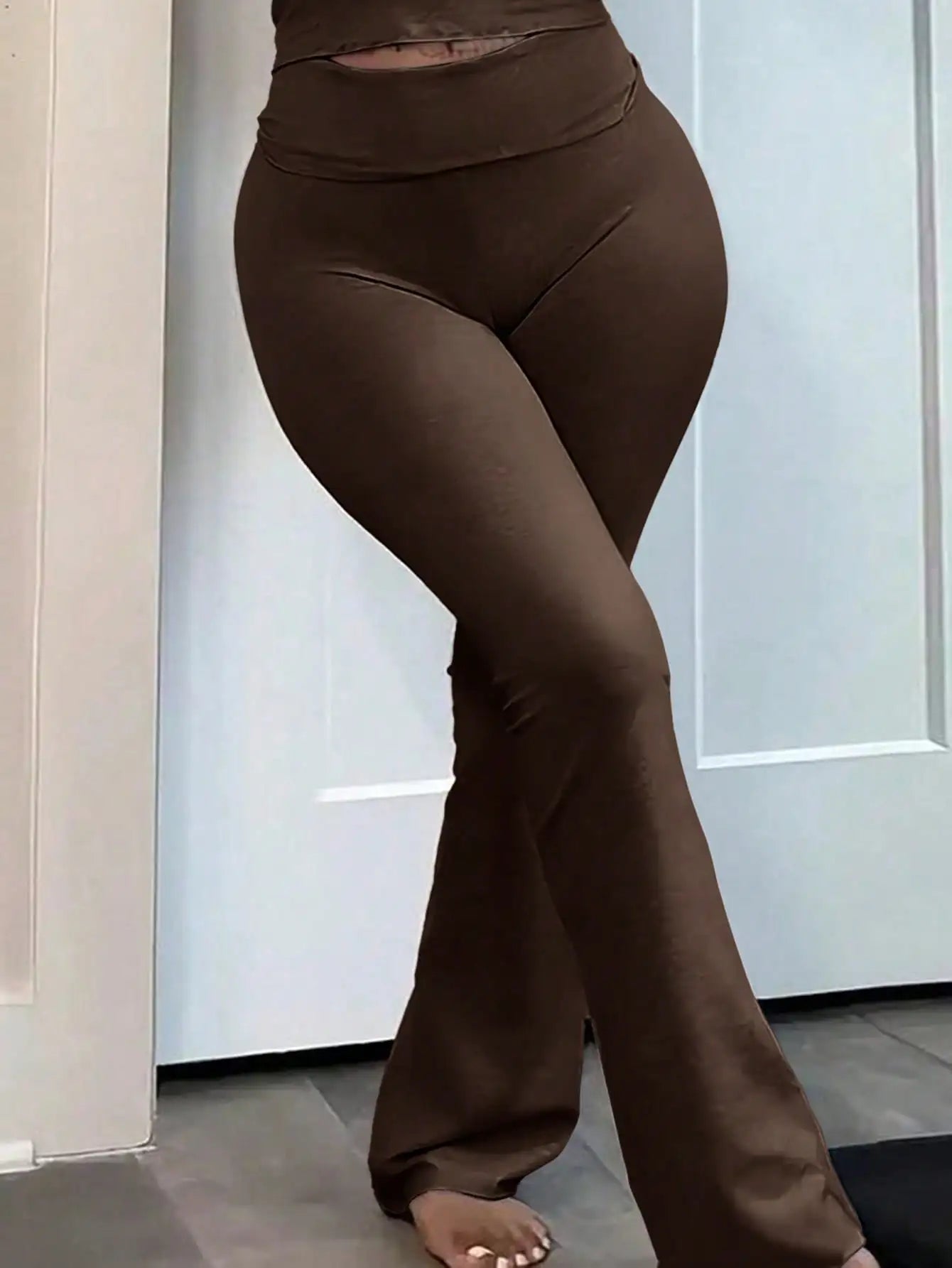 Set of three women's high-waisted flared pants from Your Outdoors n' More, showcasing different colors and relaxed fit design.