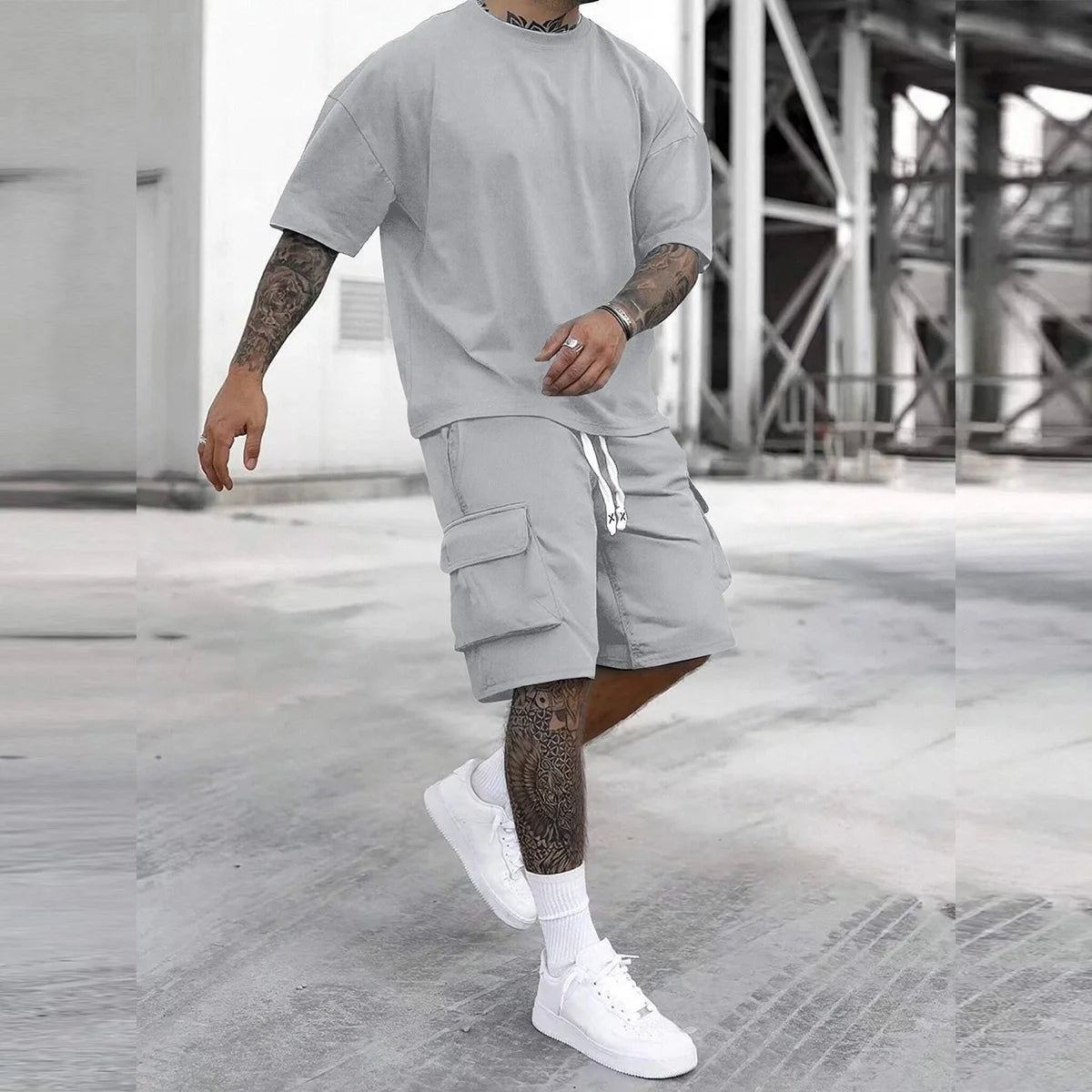 Men's multi-pocket cargo pants and short sleeve T-shirt set by Your Outdoors n' More, shown in a relaxed outdoor setting