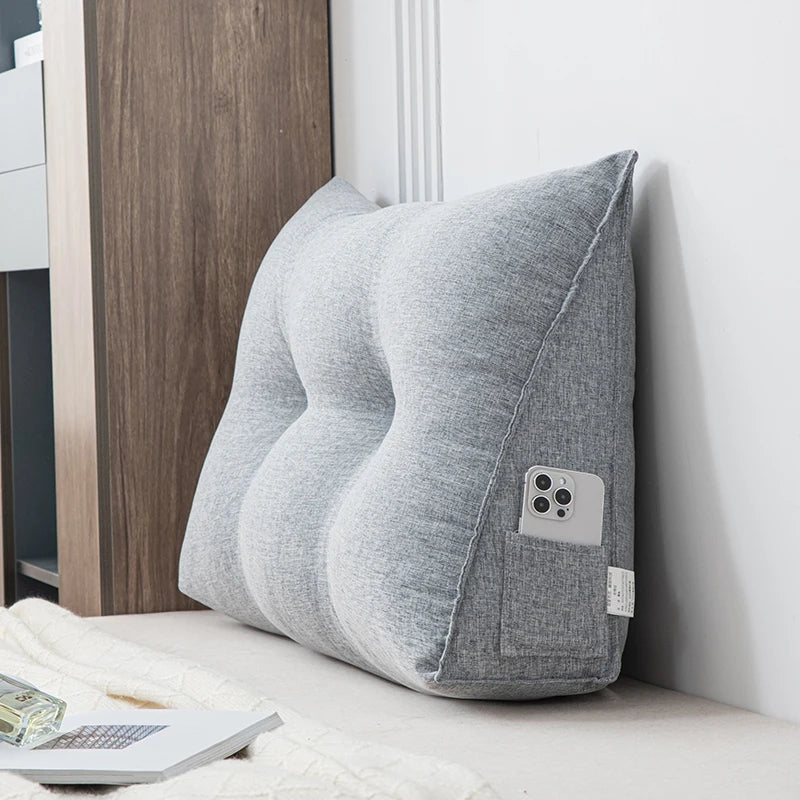 Small triangular wedge pillow with built-in massager from Your Outdoors n' More, showing the pillow's soft fabric and compact design.