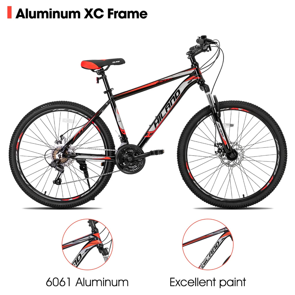 Mountain bike with Shimano 21-speed drivetrain, featuring a sturdy frame and gear shifters for versatile outdoor cycling.