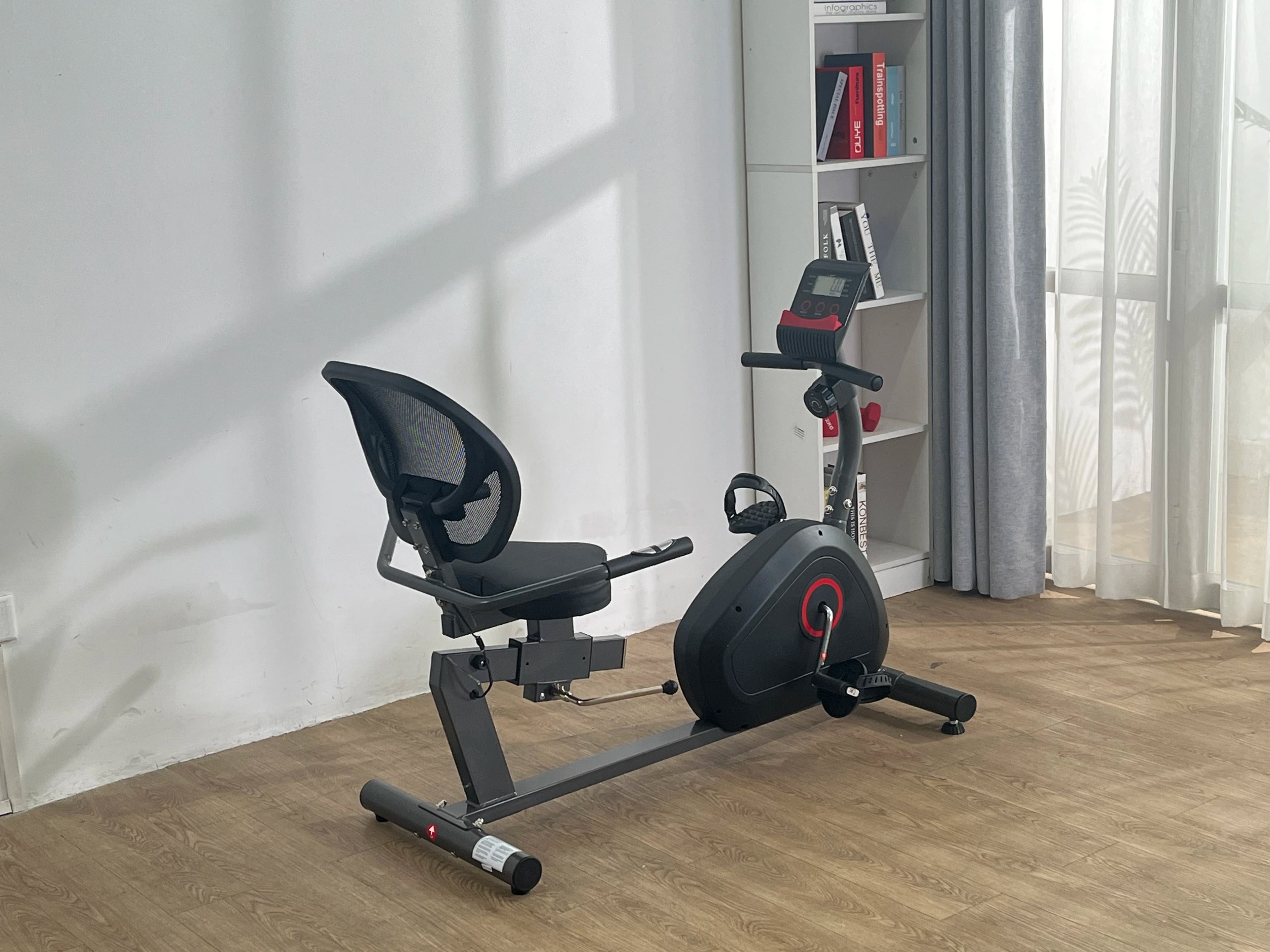 Recumbent exercise bike from Your Outdoors n' More with adjustable seat and digital display for home fitness.