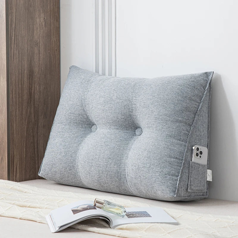 Small triangular wedge pillow with built-in massager from Your Outdoors n' More, showcasing the ergonomic design and textured surface.