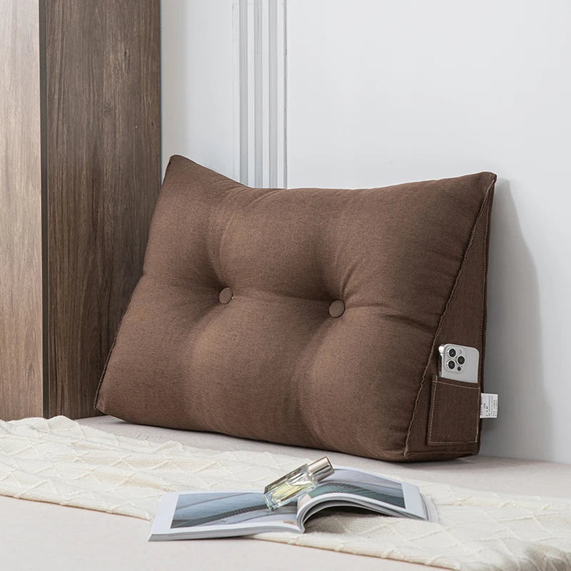 Small triangular wedge pillow with built-in massager from Your Outdoors n' More, designed for comfortable support and relaxation.