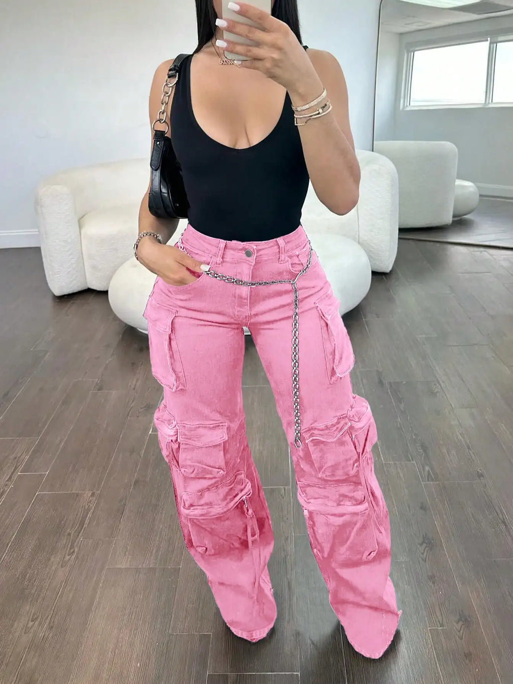 Women's pink cargo jeans from Your Outdoors n' More, featuring multiple pockets and a relaxed fit.