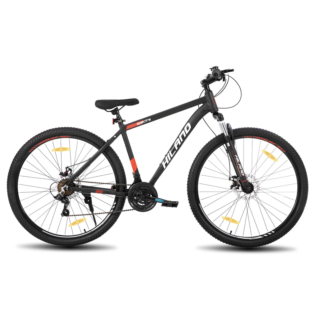 Mountain bike with Shimano 21-speed drivetrain, featuring a sturdy frame and gear shifters for versatile off-road riding.