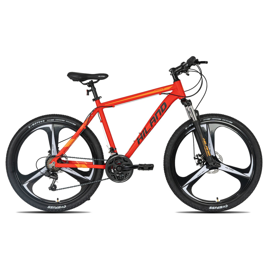 Mountain bike with Shimano 21-speed drivetrain and front suspension, featuring a lightweight frame and knobby tires for off-road riding.